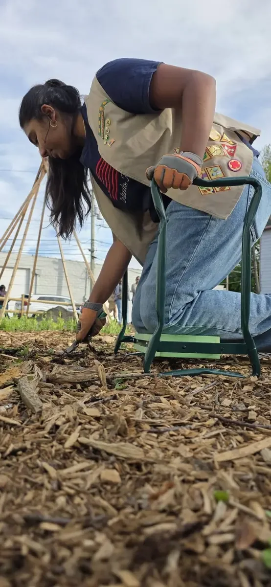 Children participating in hands on garden learning