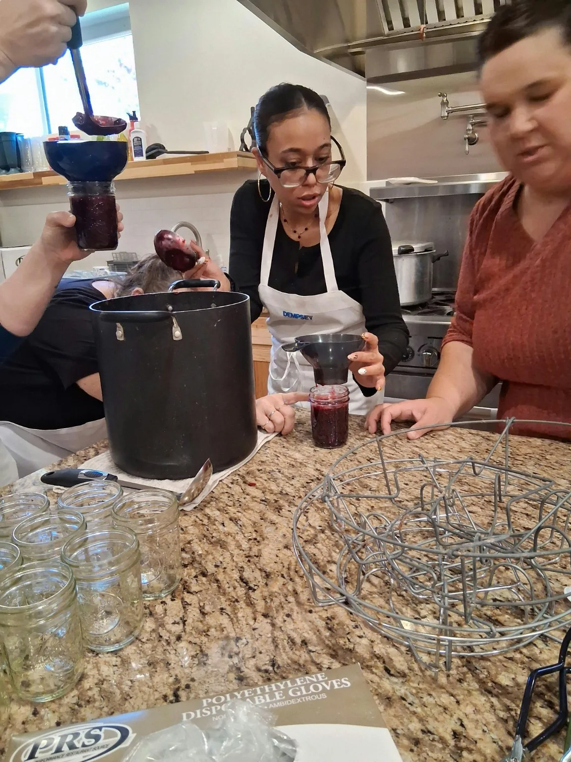 Filling jars during a GNN canning class